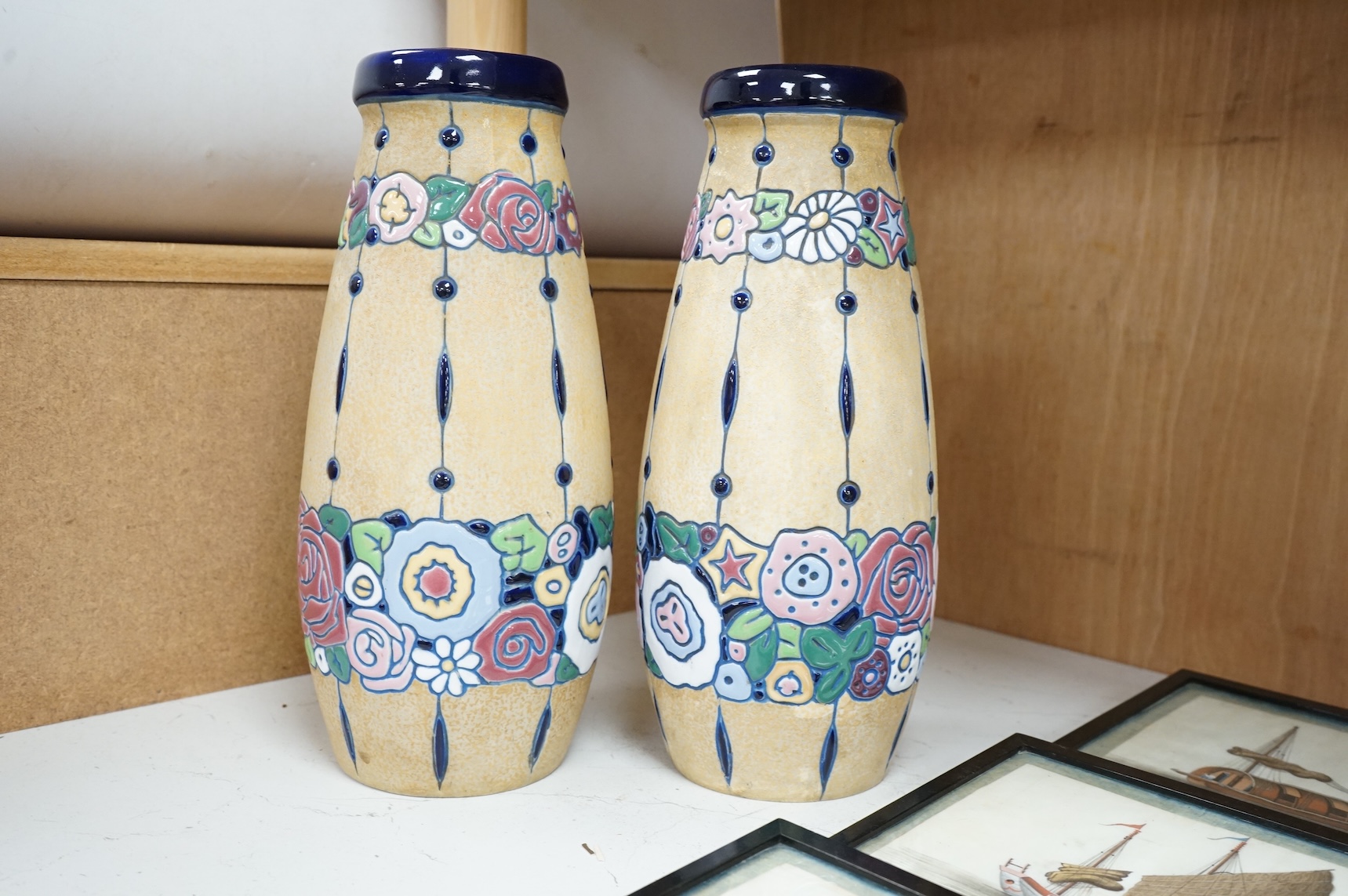 A pair of pottery Czech Amphora Art Deco pottery vases, with unusual high enamel stylised floral pattern, stamped Amphora to base, 31cm high